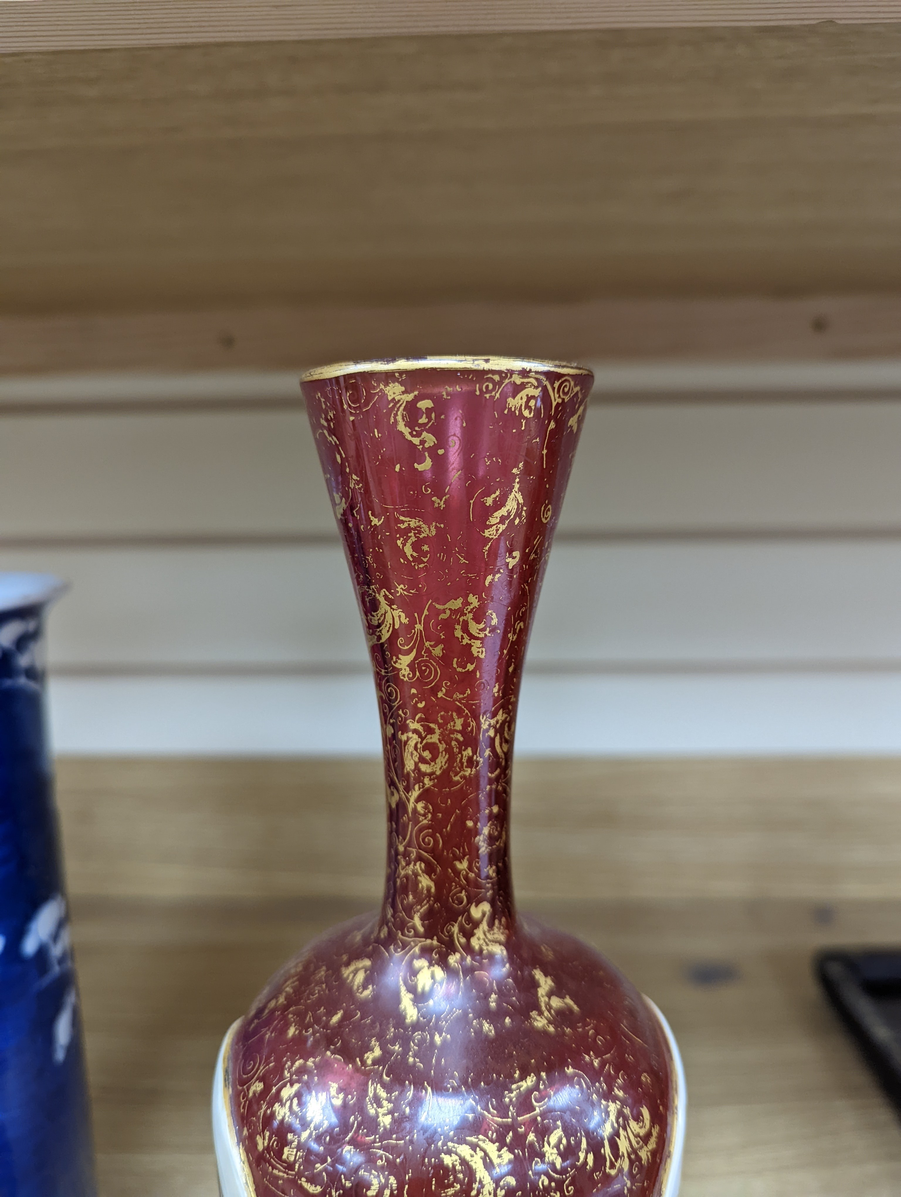 A pair of 19th century Bohemian enamelled and overlaid ruby glass vases 36cm